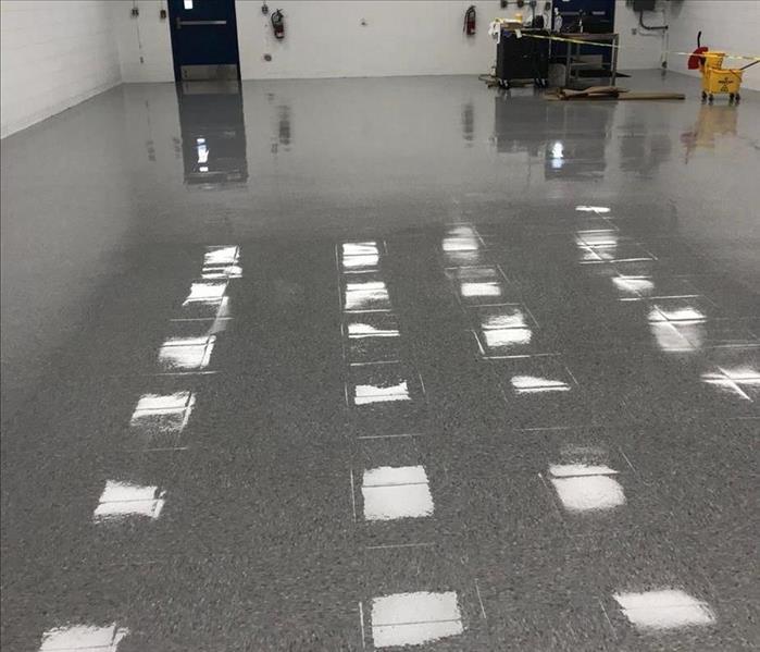 image of same grey commercial floor looking shiny, wet, and clean