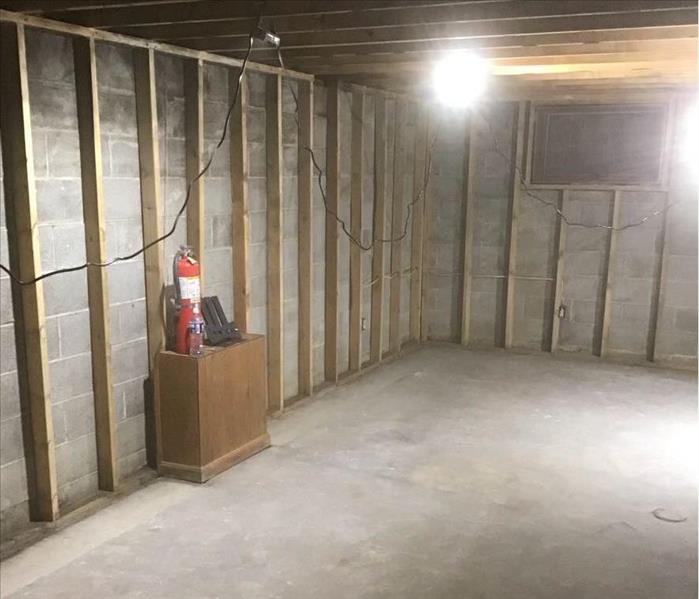 The basement has been taken down to the studs.